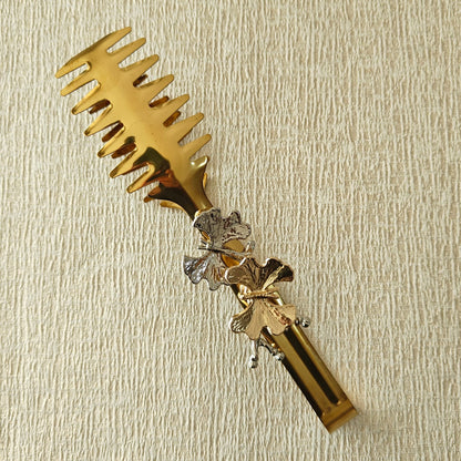 Tong in Gold