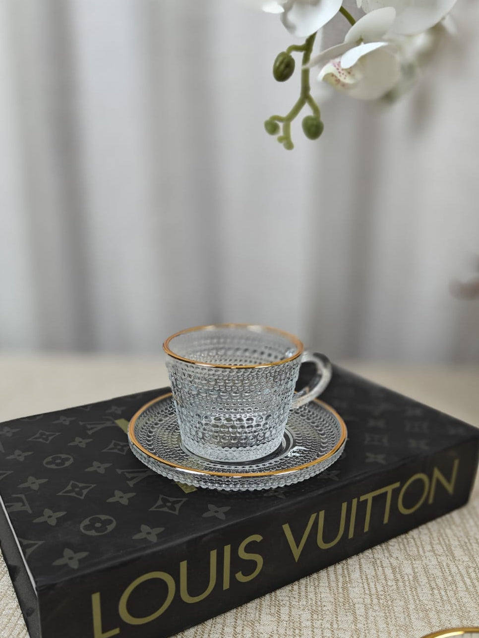 Embossed textured glass cup and saucer set