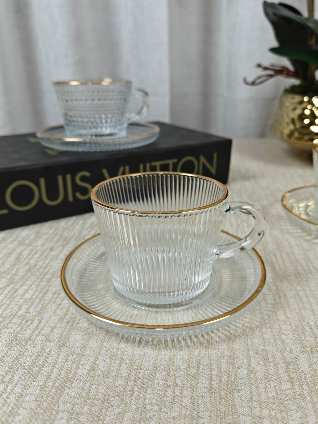 Ribbed glass tea cup and saucer set